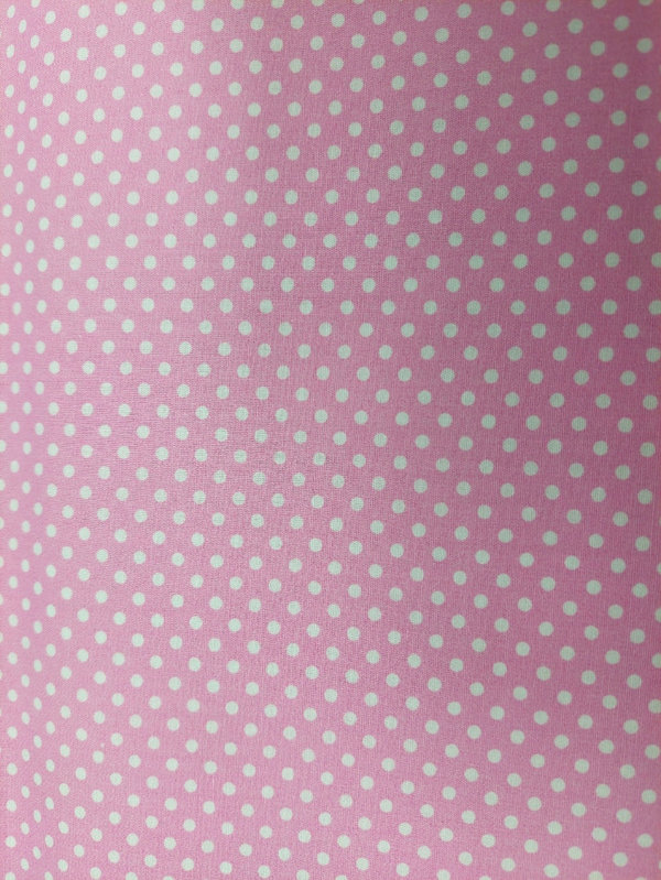 Baumwollstoff mit weißen Punkten auf pinkem Hintergrund